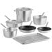 A Choice aluminum cookware set with sauce pans, a sauté pan, a stock pot, and fry pans on a bun pan with cooling rack.