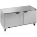 A silver Beverage-Air undercounter freezer with two doors on a counter in a school kitchen.