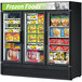 A Turbo Air Super Deluxe black swing glass door freezer with frozen foods on the shelves.