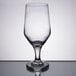 A Libbey stemmed pilsner glass on a reflective surface.
