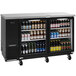 A Turbo Air Super Deluxe back bar cooler with glass doors filled with bottles of beer.