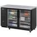 A black refrigerator with glass doors full of beer bottles.