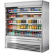 A Turbo Air stainless steel vertical air curtain display case with drinks on shelves.