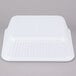 A white rectangular melamine casserole dish with a lid.