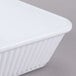 A white rectangular GET melamine casserole dish with a lid.