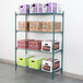 A Metroseal wire shelf with boxes on it, including white, green, and purple ones.