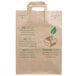 A Duro brown paper shopping bag with green text and a green leaf.