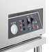 A stainless steel Noble Warewashing undercounter dishwasher with a control panel.