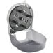 A grey and black San Jamar Four Station Standard Roll Carousel toilet paper dispenser with black handles.