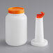 A white plastic Choice pour bottle with an orange flip top and cap.