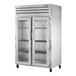 A True stainless steel 2 section glass door reach-in heated holding cabinet.