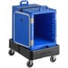 A blue plastic CaterGator food pan carrier on a black dolly with a black strap.