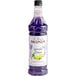 A Monin bottle of lavender lemon flavoring syrup.
