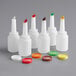 A set of six white Choice plastic pour bottles with assorted flip tops and caps.