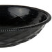 A black polyethylene round weave basket with a metal handle.