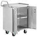 A silver Regency stainless steel utility cart with open doors.