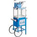 A blue and silver Carnival King Royalty Series snow cone machine on a white cart.