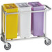 A Baker's Mark mobile triple ingredient bin cart with white, yellow, and purple bins.