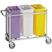 A Baker's Mark mobile triple ingredient bin cart with three different colored containers.