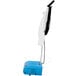 A blue and white Namco Floorwash 5000 walk behind cylindrical floor scrubber with a handle.