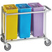 A silver metal cart with three rectangular plastic bins in yellow, blue, and purple with clear lids.