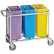 A yellow, blue, and purple rectangular container on a metal cart.