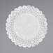 A white Lace Normandy doily on a gray background.