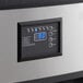 An Avantco black and silver rectangular undercounter ice machine control panel with a digital display and buttons.