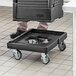 A black dolly with wheels for a Choice insulated food pan carrier.