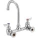 A chrome Waterloo wall mount faucet with silver knobs.