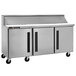 A Traulsen stainless steel 3 door commercial sandwich prep table.