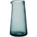 A clear glass carafe with a blue base and curved neck.