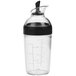 An OXO Good Grips plastic salad dressing shaker with a black and white bottle and a black lid.