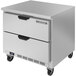 A stainless steel Beverage-Air worktop freezer with two drawers on black wheels.