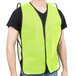 A man wearing a yellow Cordova high visibility safety vest with black trim.