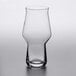 A Rastal Craft Master One beer glass with a clear surface and smooth rim on a table.