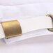 A white fabric Chef Revival chef beret with a brass buckle.
