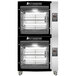 A large black and silver Rotisol-France electric rotisserie oven with racks on top.