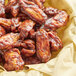 A close up of chicken wings with Cattlemen's Sweet and Bold BBQ Sauce on a plate.