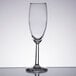 A close-up of a Libbey Napa Country flute wine glass on a white surface.