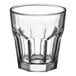 An Acopa Memphis clear glass tumbler with a curved rim.