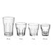 A group of Acopa Memphis clear rocks glasses with curved edges.