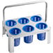 A metal tray with 6 blue plastic cylinders with holes in them.