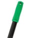 A close-up of a green and black Unger Heavy Duty Floor Scraper handle.