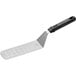 A Choice metal perforated turner with a black handle.