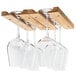 A group of wine glasses hanging from a Fox Run wooden rack.