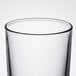 An Arcoroc beverage glass on a white background.