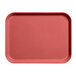 A red Cambro rectangular tray on a counter.