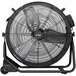 An XPOWER black drum fan with a black base.
