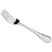 An Acopa Inspira stainless steel dinner fork with a textured silver handle.